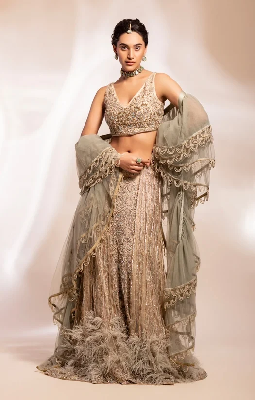 Bridal lehenga,blouse and drape shawl in heavy sage green beaded embroidery.